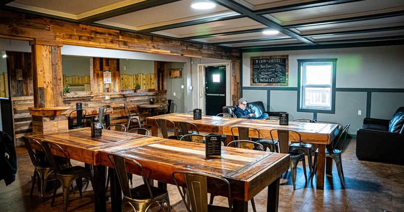 Interior dining and seating area, long tables ready for guests