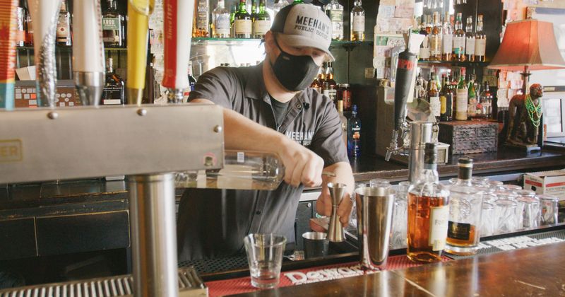 Staff member working behind the bar