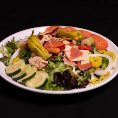 Chopped Salad, with mixed greens, Italian meats, cheeses, and marinated veggies.