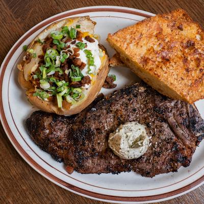 A served  Tad's Famous Steak.