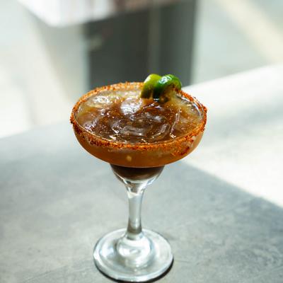 A spicy tamarind margarita, served.