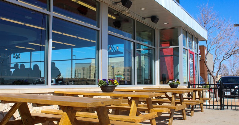 Exterior, outdoor seating area featuring picnic tables and benches