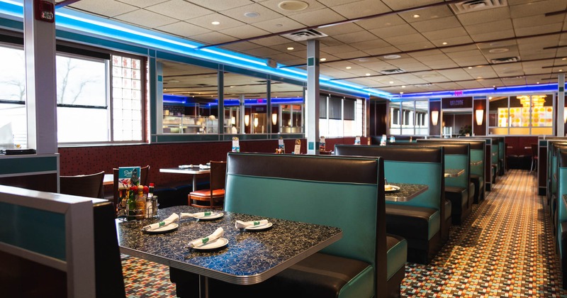 Interior, inline booths with tableware on tables