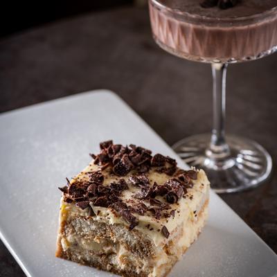 Tiramisu plate with a glass of Espresso Martini.