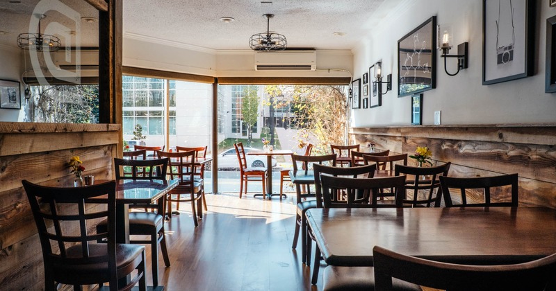 Interior, seating area, large shop window, air condition unit, wooden flooring, chandelier