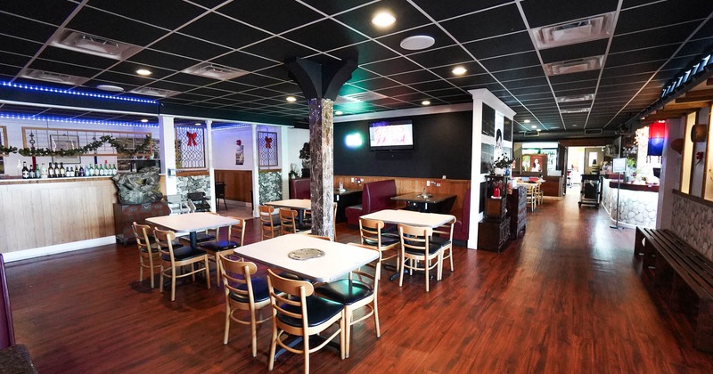 Interior, spacious seating area with tables and chairs