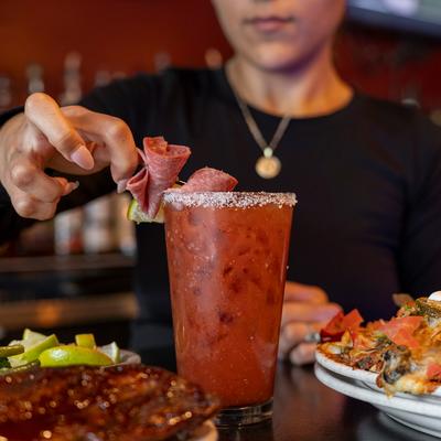 Bartender preparing a Bloody Mary.