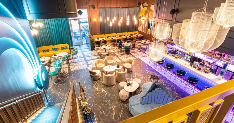 Interior, chandeliers, decorative lighting, upholstered armchairs and benches, booths, tables