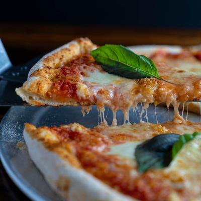 Margherita pizza, cheese pull shot.
