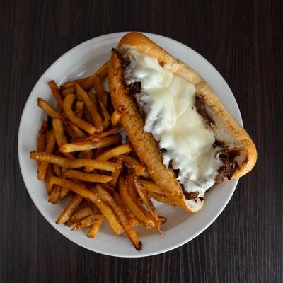 Philly Cheesesteak, served with fries.