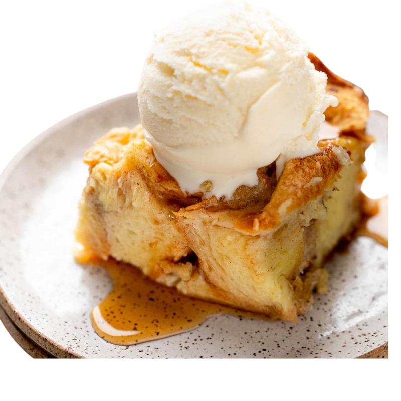 Creme Brûlée Bread Pudding Topped With Scoop of Ice Cream photo