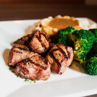 Steak tips, served with mashed potatoes, gravy and broccoli