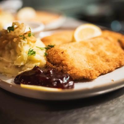 Wiener Schnitzel with mashed potatoes and lingonberry sauce.