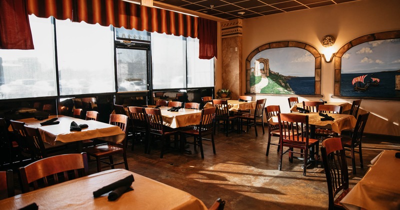 Interior, dining tables ready for guests