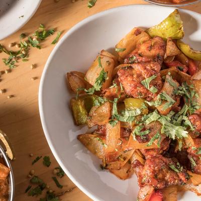 Chicken cooked with bell peppers, onion, soy sauce, ketchup, and jalapenos.