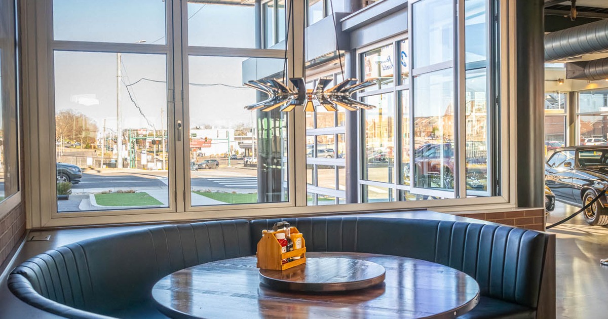 A round booth by a window