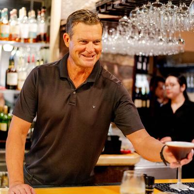 Bartender serving drinks.