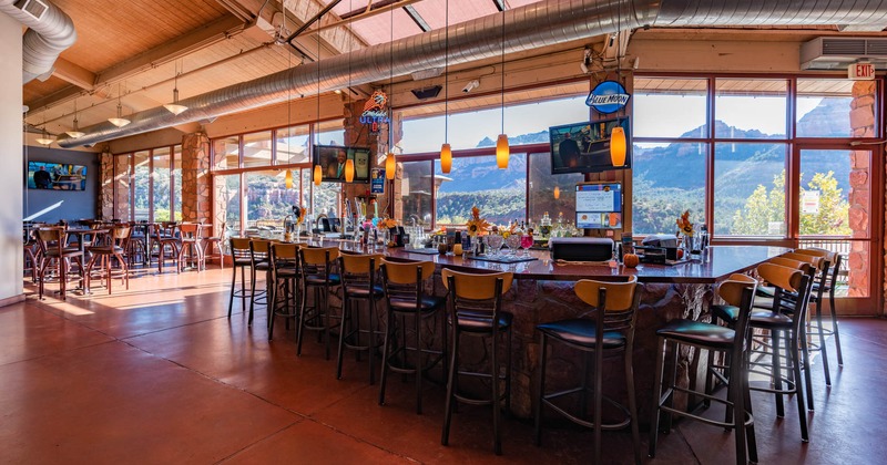 Interior, counter, tables, chairs, windows with a view, lighting