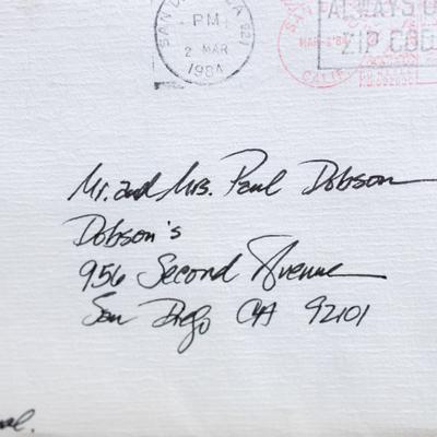 An envelope with a handwritten address