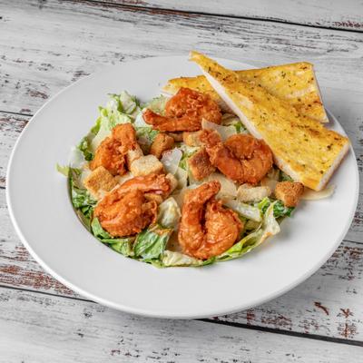 Buffalo Shrimp Caesar served with garlic bread