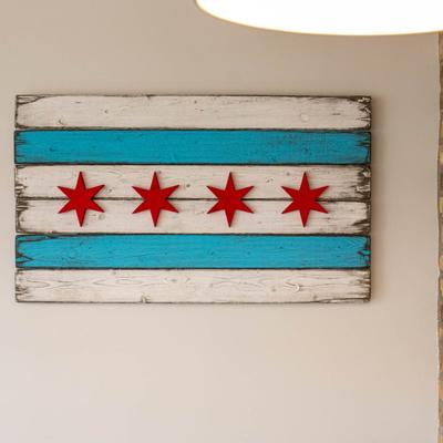 Flag of Chicago rustic board hanging on a wall inside.