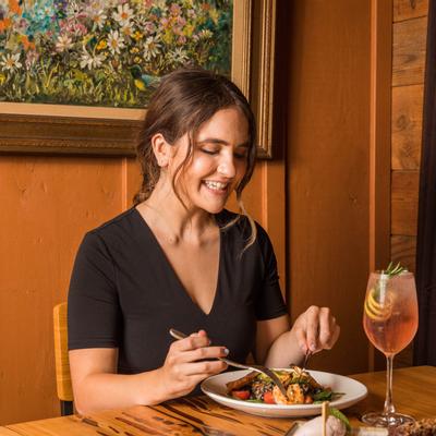 Guest eating a dish at table
