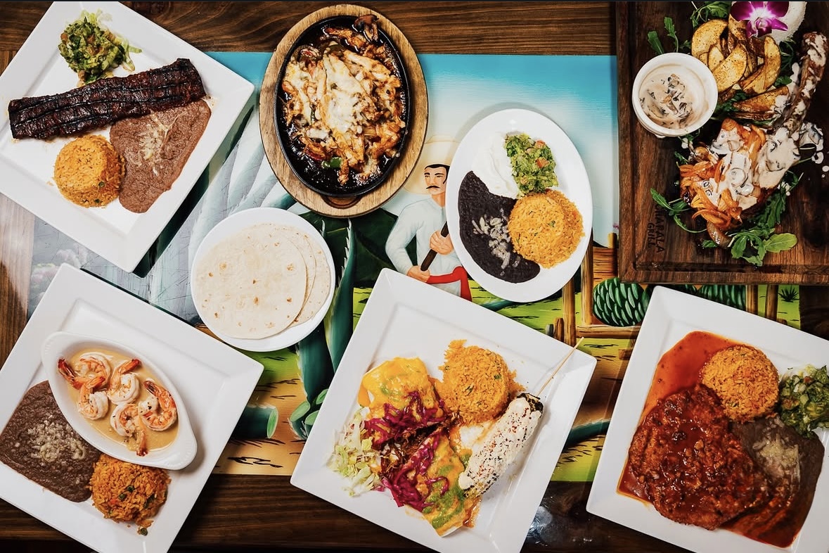 Various Mexican dishes arranged on a colorful table