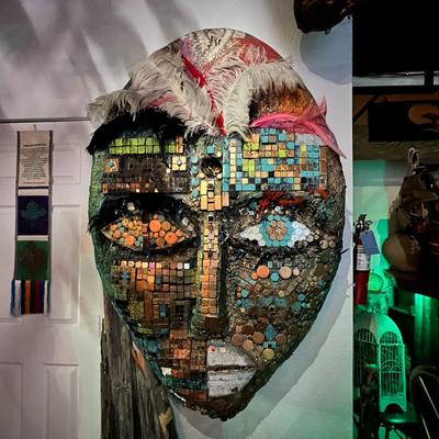 A wall decoration of a large mask.