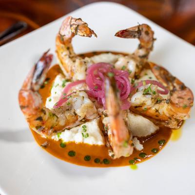 Prawns on mashed potatoes, pickled red onions and chipotle sauce