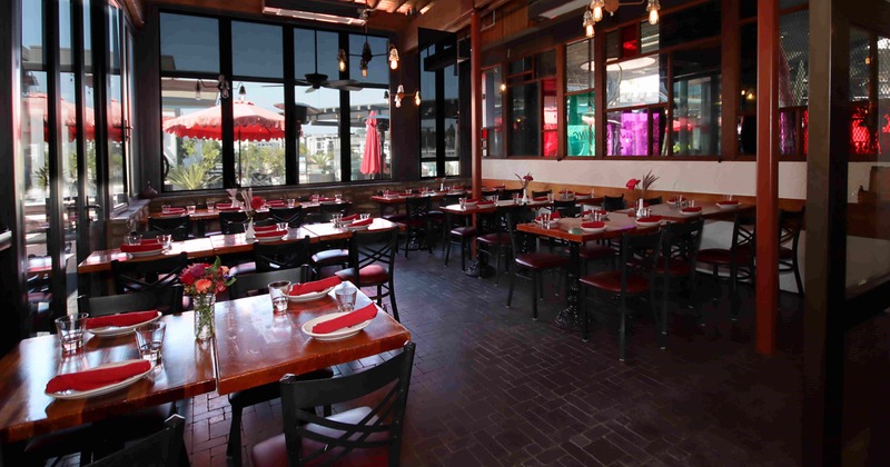Interior, dining area, wooden top tables with chairs, ready for guests , ceiling fans