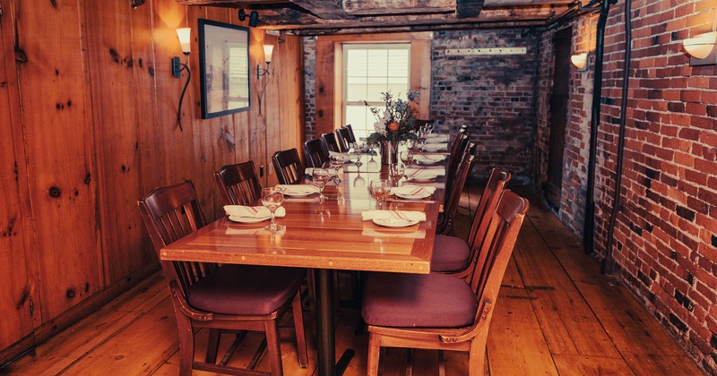 Private parties room, table with tableware and wine glasses