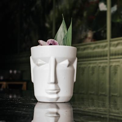 Cocktail Eleggua, mezcal based, passion fruit pure, rice milk and peach foam.