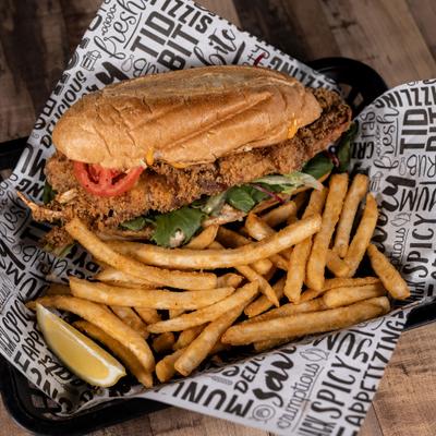 Soft shell crab sandwich served with fries.