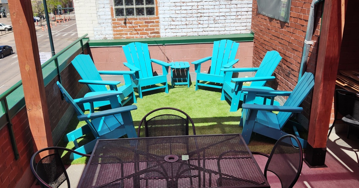 Rooftop patio, lounge seating area, Adirondack blue wooden chairs