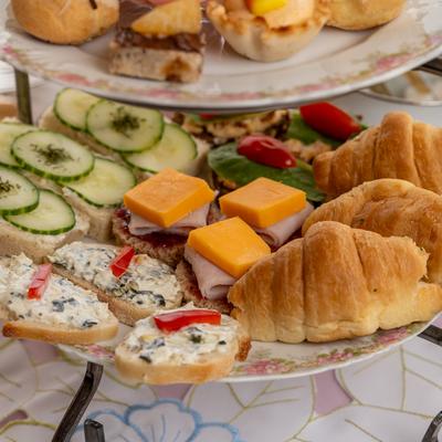 Afternoon tea tray with assorted pastries.