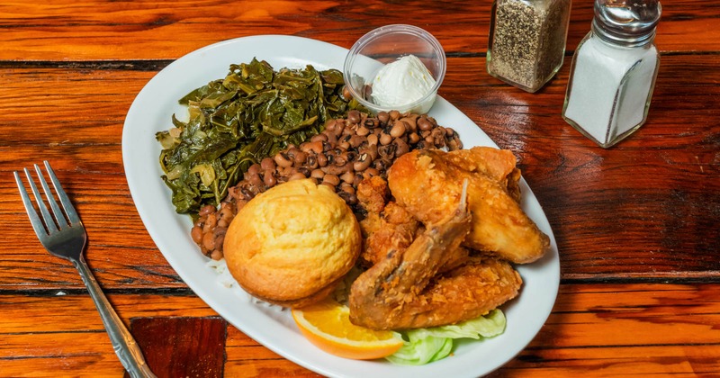 Combo plate with chicken,black eyed peas, collards, and cornbread