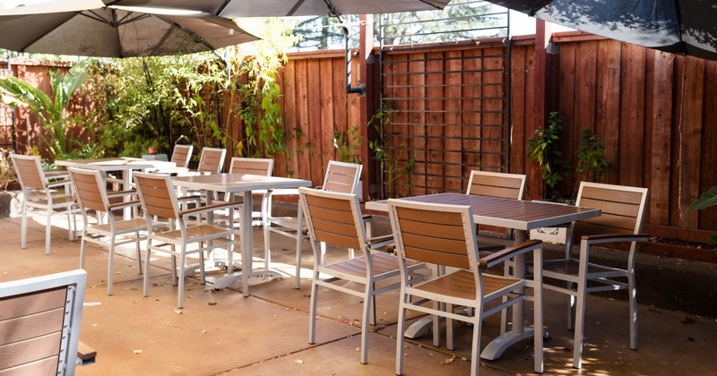 Outdoor patio seating area, tables and chairs