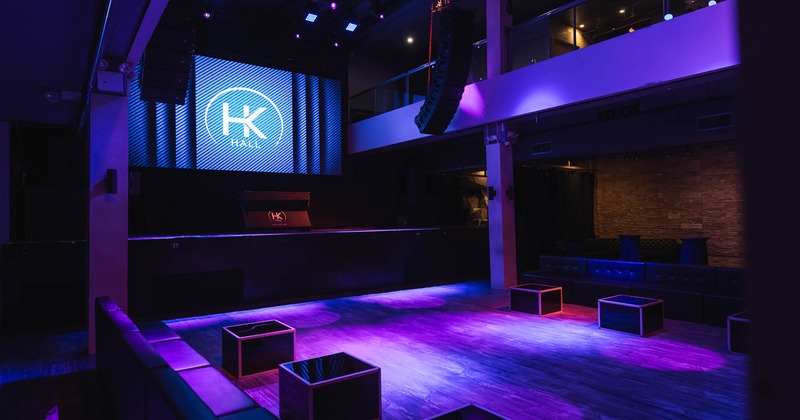 Interior, vide open space with a stage in the back