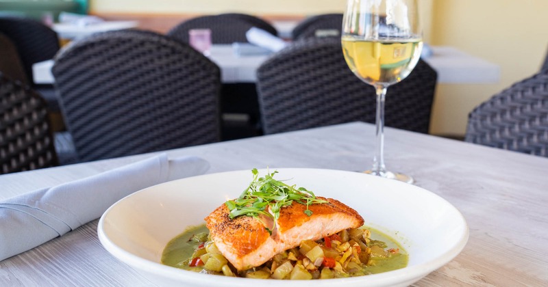 Pan-seared salmon with a glass of white wine