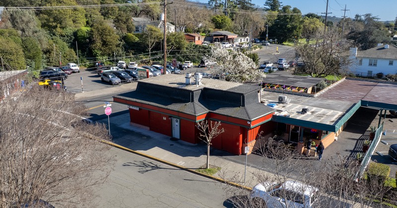 Exterior, aerial view to street, restaurant and parking lot
