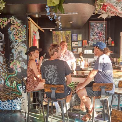 Customers sitting at the bar.