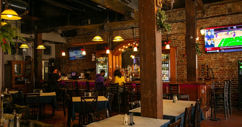 Cozy interior dining area, bar area with guests
