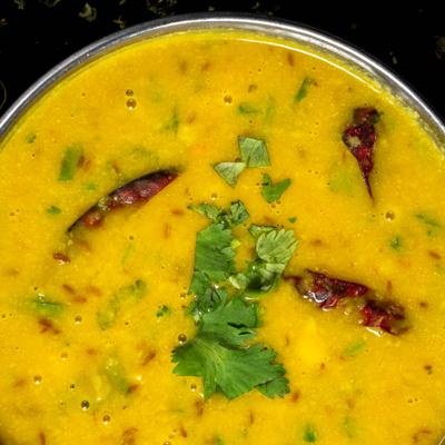 Cooked flavored lentils are done with a treating made of ghee.