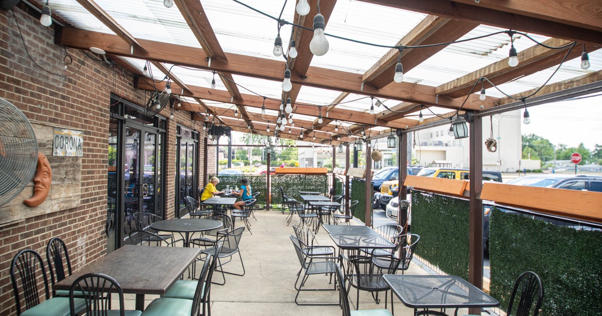 Exterior, roof covered patio, tables and seats