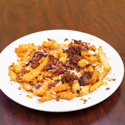 Loaded fries, with nacho cheese, bacon, and chorizo.