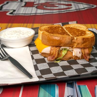 Grilled turkey, bacon, and cheese sandwich.