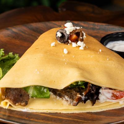 Beef and lamb mix meat, tzatziki sauce, feta cheese, cherry tomatoes, red onions, black olives, and spring mix.