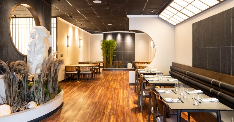 Interior seating area with tables, chairs and booths