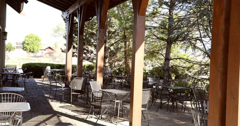 Covered patio with tables and chairs