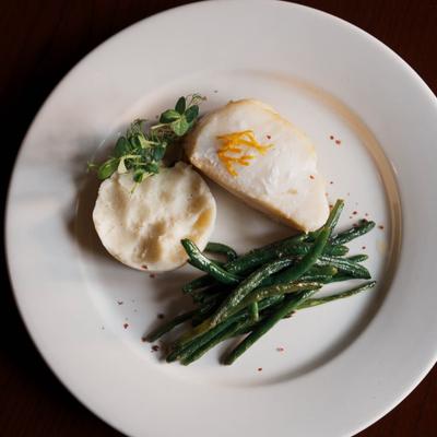 Chilean sea bass, served with mashed potatoes and green beans.